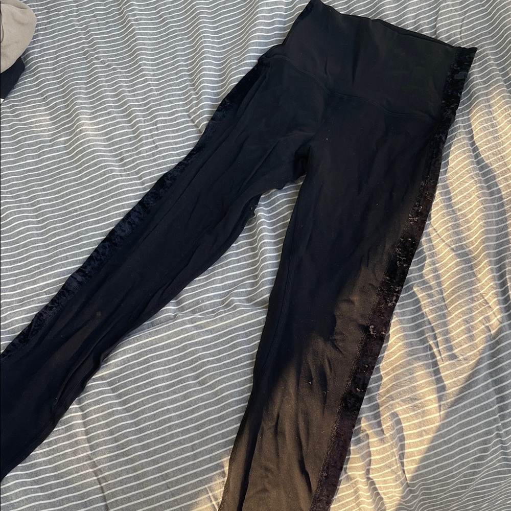 Lululemon black  rare legging with velour stripe size 4 . Good condition